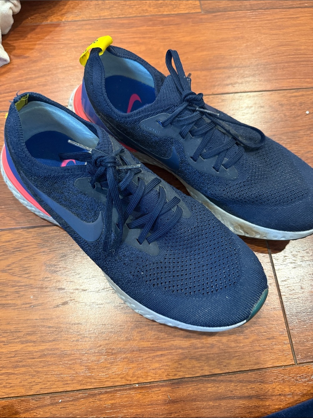 Nike Navy Running Shoes with Pink and Yellow Accents